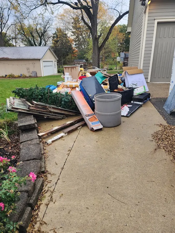 Dumpster being loaded with debris for Commercial Dumpster Rental in Pembroke Park